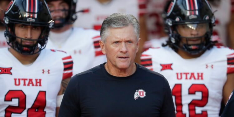 Utah head coach Kyle Whittingham with players.