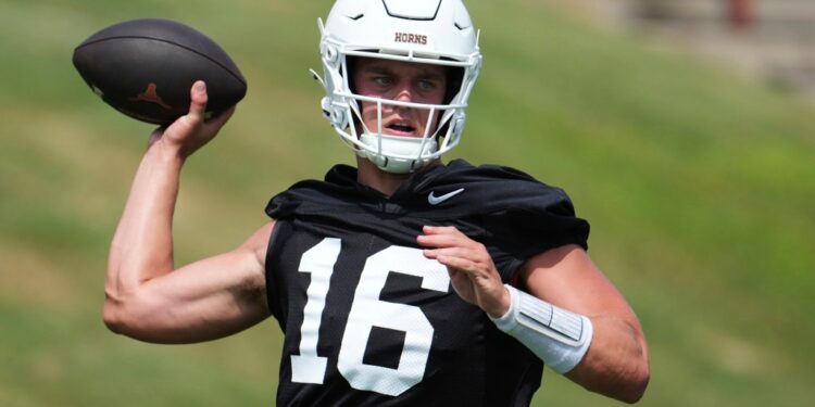 Texas football player throwing a football.
