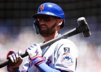 New York Mets player Brandon Nimmo with a sledgehammer.