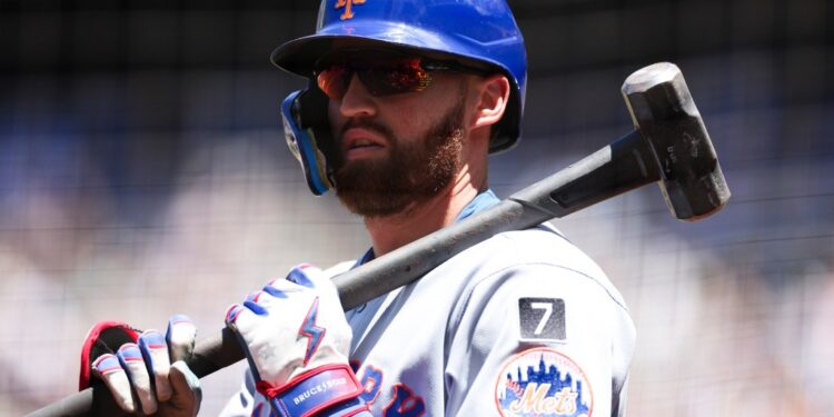 New York Mets player Brandon Nimmo with a sledgehammer.
