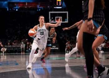Sabrina Ionescu #20 of the New York Liberty dribbling the ball.