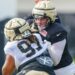New Orleans Saints center Will Clapp (76) blocks defensive tackle Khristian Boyd (97) during training camp at Ochsner Sports Performance Center.