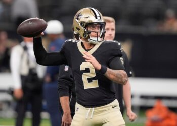 New Orleans Saints quarterback throwing a football.