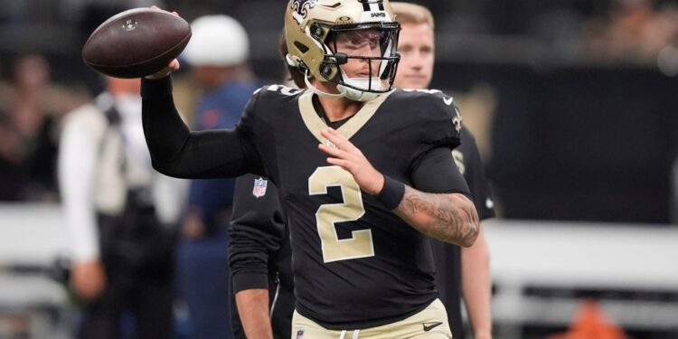 New Orleans Saints quarterback throwing a football.