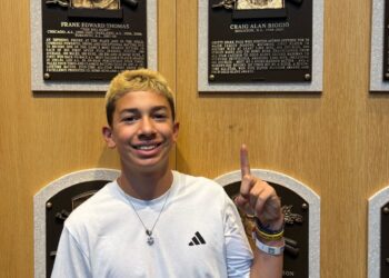 St. John's-Smithtown Little League star Jeremy Katz points to his hero Craig Biggio's plaque at the Baseball Hall of Fame.