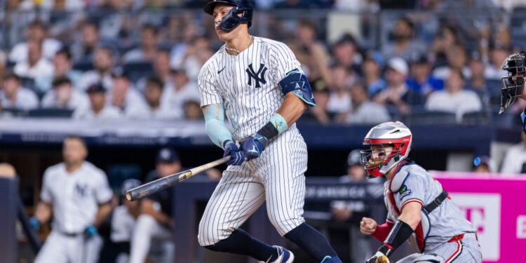 New York Yankees' Aaron Judge (99) RBI single scores Anthony Volpe (11) in the seventh inning against the Minnesota Twins at Yankee Stadium, Monday, Aug. 11, 2025, in Bronx, NY.