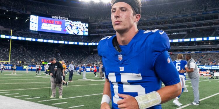 New York Giants quarterback Tommy DeVito (15) leaving the field.