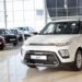 White Kia Soul in a car showroom.