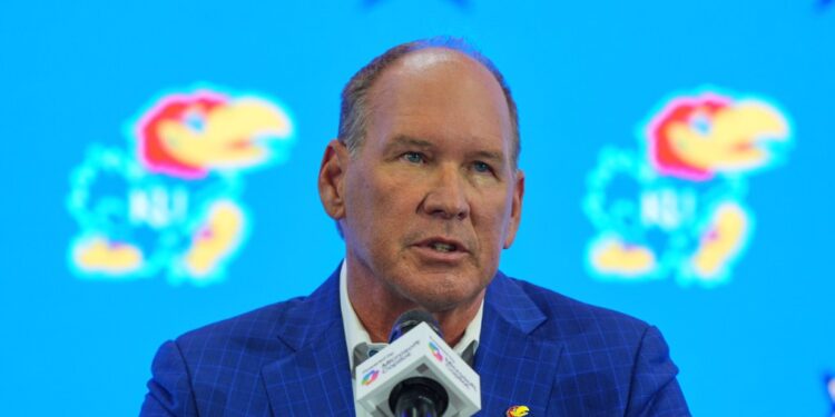 Lance Leipold speaking at a press conference.