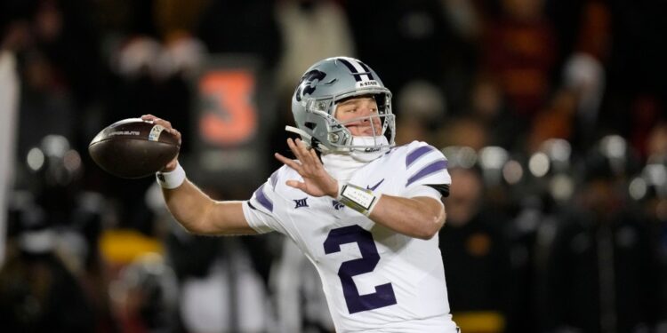 Kansas State quarterback throwing a football.