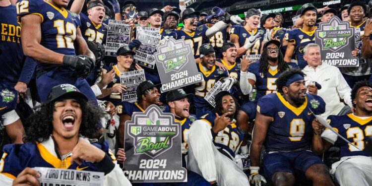Toledo celebrates its six-overtime win over Pittsburgh.