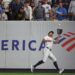 Giancarlo Stanton making a catch in a baseball game.