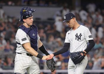 New York Yankees catcher and pitcher shaking hands.
