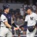 New York Yankees catcher and pitcher shaking hands.