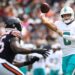 Zach Wilson, Miami Dolphins quarterback, throwing a football.