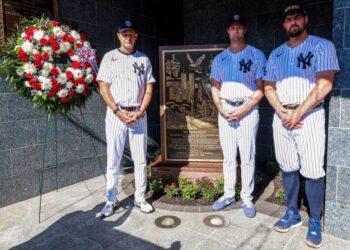 Left to right: Aaron Boone, Gerrit Cole and Carlos Rodón place a wreath on the monument commemorating the 2001 terrorist attacks in Monument Park before the Yankees' 9-3 blowout win over the Tigers on Sept. 11, 2025.