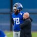 New York Giants player Andrew Thomas speaks with head coach Brian Daboll.