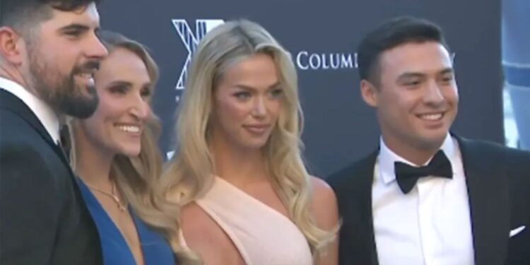 Anthony Volpe poses with stunning blonde at Yankees charity event