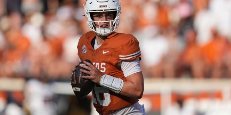 Arch Manning, Texas quarterback, holding a football.