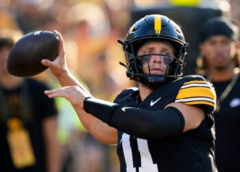 Iowa quarterback Mark Gronowski warms up before an NCAA college football game against Massachusetts.