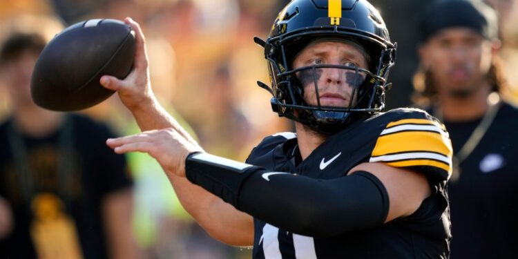 Iowa quarterback Mark Gronowski warms up before an NCAA college football game against Massachusetts.