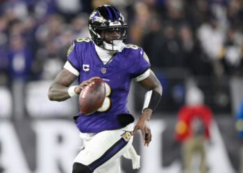 Football player Lamar Jackson in action.