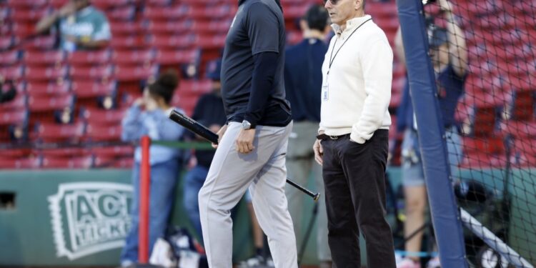 General manager Brian Cashman and manager Aaron Boone look on during warmups before the Yankees' 4-1 win over the Red Sox on Sept. 13, 2025.