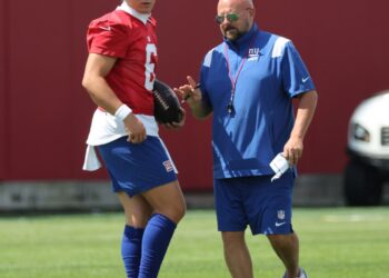 Giants head coach Brian Daboll speaking to quarterback Jaxson Dart #6, during practice at the New York Giants training facility in East Rutherford, New Jersey.
