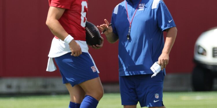 Giants head coach Brian Daboll speaking to quarterback Jaxson Dart #6, during practice at the New York Giants training facility in East Rutherford, New Jersey.