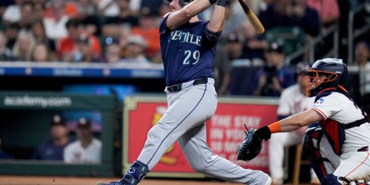 Cal Raleigh hits a solo home run against the Houston Astros.