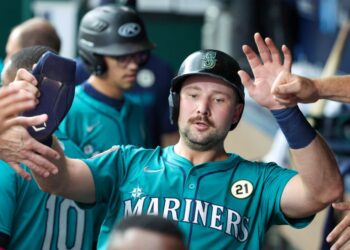 Cal Raleigh celebrates after hitting a homer i the first inning, the first of two of his long balls in the Mariners' 12-5 blowout win over the Royals on Sept. 16, 2025. He now has 56 homers on the season.