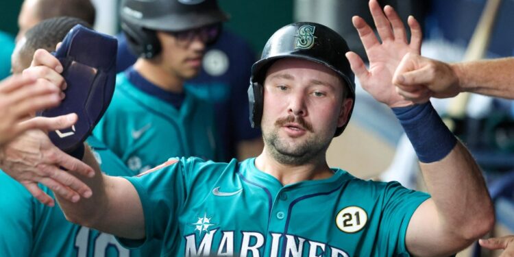 Cal Raleigh celebrates after hitting a homer i the first inning, the first of two of his long balls in the Mariners' 12-5 blowout win over the Royals on Sept. 16, 2025. He now has 56 homers on the season.