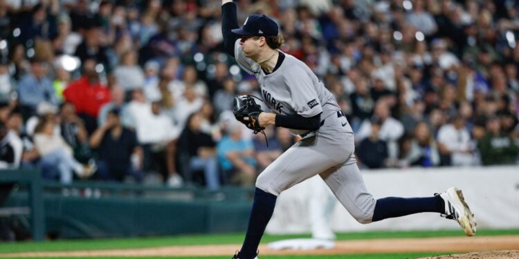 New York Yankees pitcher Cam Schlittler pitching a ball.