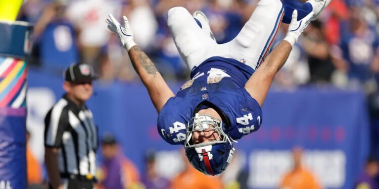 Cam Skattebo celebrates after scoring a touchdown during the Giants-Chargers game on Sept. 28, 2025.