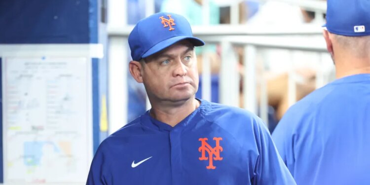 Carlos Mendoza #64 of the New York Mets reacts in the dugout during the fourth inning.