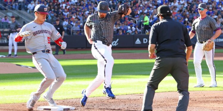 New York Mets pitcher Nolan McLean (26) misses the bag allowing Washington Nationals third base Brady House (55) on New York Mets first base Pete Alonso (20) error during the second inning when the New York Mets played the Washington Nationals Saturday, September 20, 2025 at Citi Field in Queens, NY.