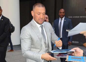 Conor McGregor signing autographs in NYC.