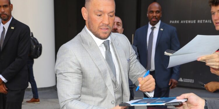 Conor McGregor signing autographs in NYC.