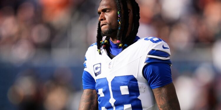 Dallas Cowboys wide receiver CeeDee Lamb walks along the sideline after suffering an unknown injury in the first half of an NFL football game against the Chicago Bears Sunday, Sept. 21, 2025, in Chicago.
