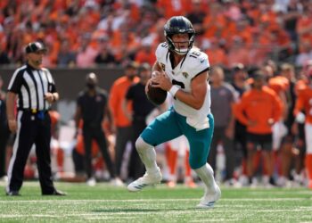 Trevor Lawrence, Jacksonville Jaguars quarterback, running with the football.