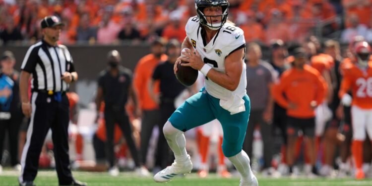 Trevor Lawrence, Jacksonville Jaguars quarterback, running with the football.