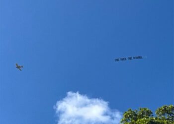 A plane flew over Hard Rock Stadium in Miami, flying a banner that read, "Fire Grier. Fire McDaniel" before the Dolphins' loss to the Patriots on Sunday, September 14, 2025.