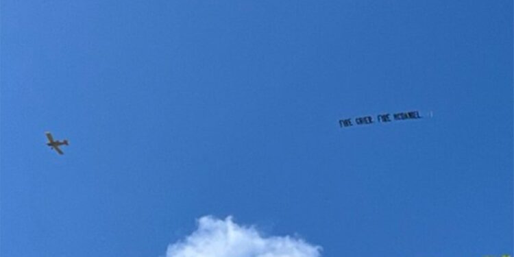 A plane flew over Hard Rock Stadium in Miami, flying a banner that read, "Fire Grier. Fire McDaniel" before the Dolphins' loss to the Patriots on Sunday, September 14, 2025.
