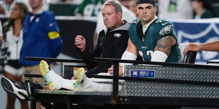 Injured Philadelphia Eagles player Ben VanSumeren being carted off the field.