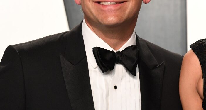 Lachlan Murdoch smiling at the 2020 Vanity Fair Oscar Party.