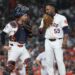 Houston Astros catcher and pitcher confer on the mound.