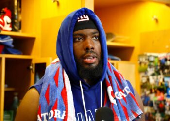 Andrew Thomas talks to reporters after Giants practice on Sept. 19, 2025.