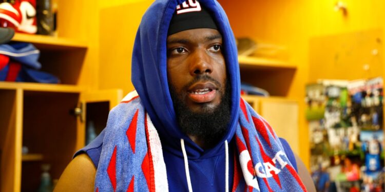 Andrew Thomas talks to reporters after Giants practice on Sept. 19, 2025.