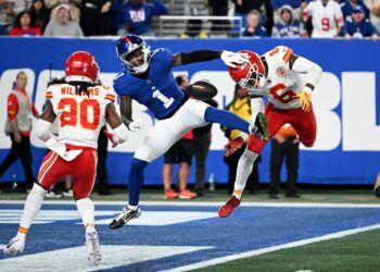 Wide receiver Malik Nabers #1 of the New York Giants fails to complete a reception and collides with safety Bryan Cook #6 of the Kansas City Chiefs and cornerback Nohl Williams #20 of the Kansas City Chiefs during the fourth quarter of the Giants and Kansas City Chiefs game in East Rutherford, N.J.