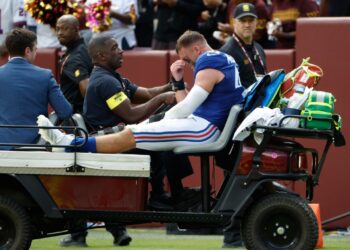 Injured New York Giants player on a medical cart.